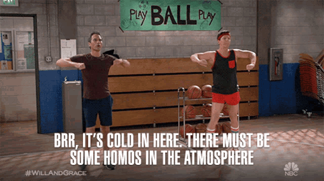 two men are dancing in front of a sign that says " play ball play "
