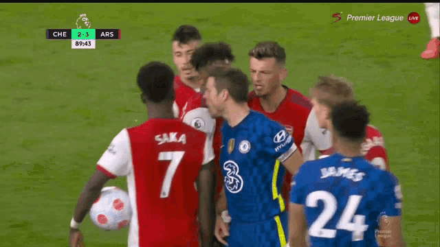 a group of soccer players including saka and james are on a field