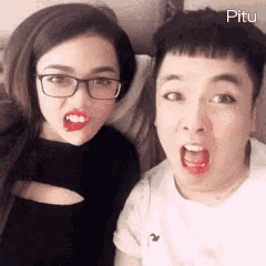 a man and a woman are posing for a picture with the word pitu on the bottom