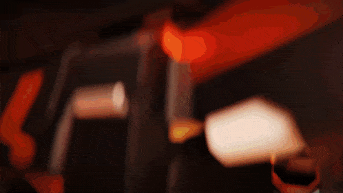 a blurred image of a person wearing a virtual reality headset in a dark room