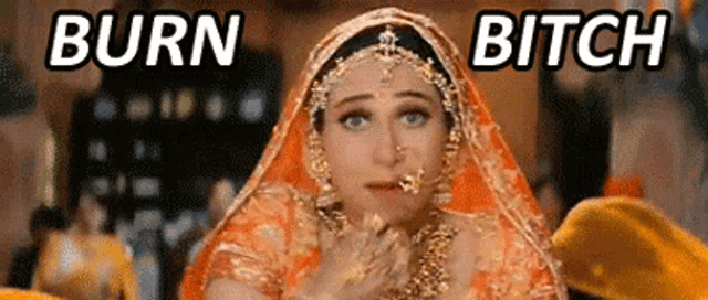 a woman in a wedding dress with the words burn bitch written above her