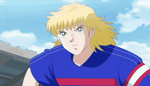 a man with blonde hair and blue eyes is wearing a blue shirt