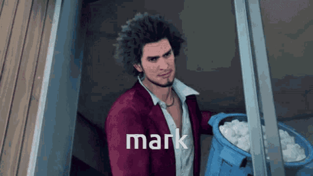 a man in a red jacket is holding a blue bucket of ice and the word mark is above him
