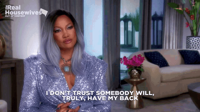 a woman in a purple sequined dress says i don t trust somebody will truly have my back