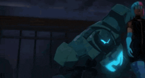 a group of cartoon characters are standing next to each other in front of a robot that is glowing in the dark .