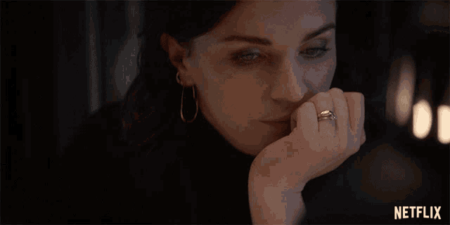 a woman with a ring on her finger is featured on a netflix ad