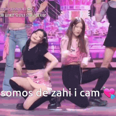 a group of girls are kneeling down on a stage with the words somos de zahi i cam in the corner