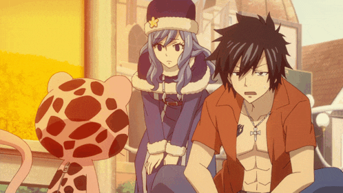 a man and a woman are sitting next to each other with a leopard in the background