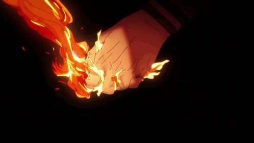 a close up of a person holding a fire
