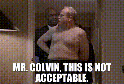 a man without a shirt is standing in a hallway with the words mr. colvin this is not acceptable