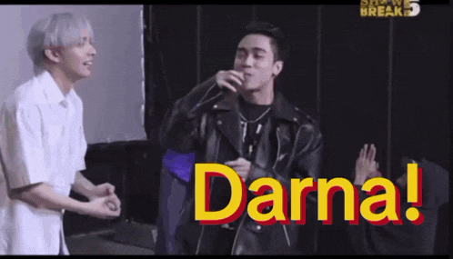 two men are standing next to each other and the word darna is on the bottom