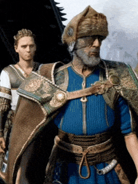 a man with a beard wears a blue cape and a hat