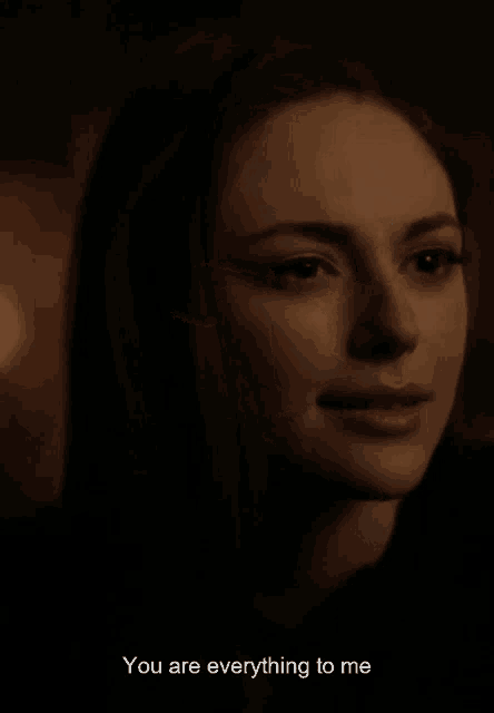 a close up of a woman 's face with the words " you are everything to me " next to her