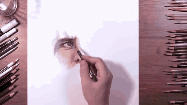 a drawing of a person 's face is being drawn with a pencil that says prismacolor