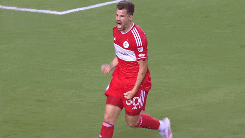 a soccer player wearing the number 3 on his jersey