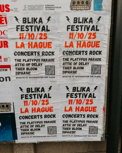 a bunch of flyers for blika festival are taped to a wall