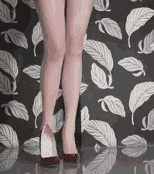 a woman wearing red high heels is standing in front of a leafy wallpaper