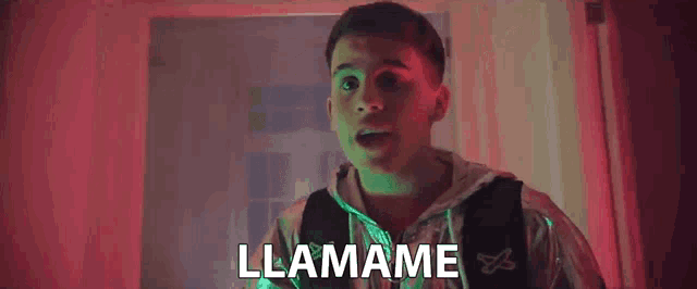 a man with a backpack is standing in a hallway and the word llamame is above him