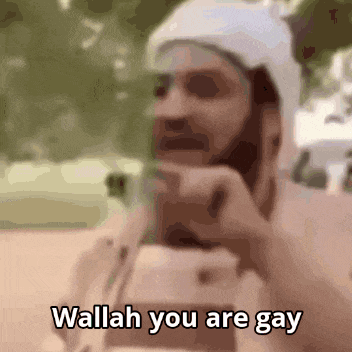 a man with a beard and a white hat says wallah you are gay