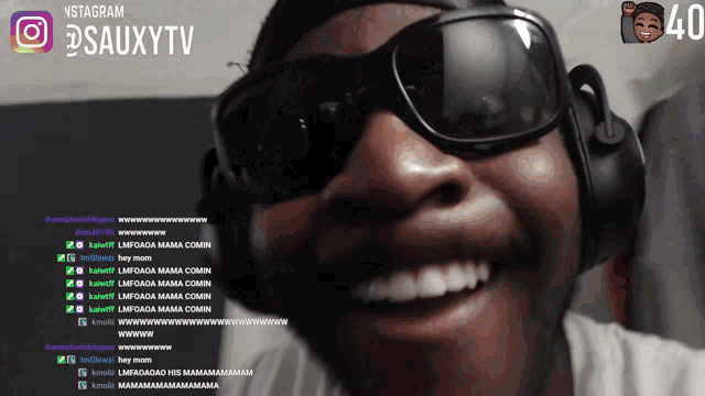 a man wearing sunglasses and headphones is smiling in front of a screen that says instagram @sausytv