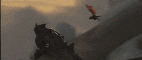 a man is riding on the back of a dragon while a dragon flies overhead .