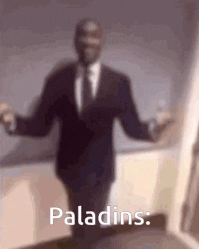 a blurry picture of a man in a suit and tie with the words paladins written below him