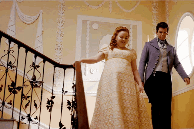 a man and a woman are walking down stairs