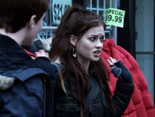 a woman stands in front of a store with a sign that says especial $ 9.99