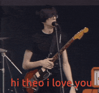 a man playing a guitar and singing into a microphone with the words hi theo i love you written below him