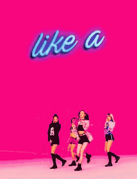 a group of girls are dancing in front of a sign that says like a on it