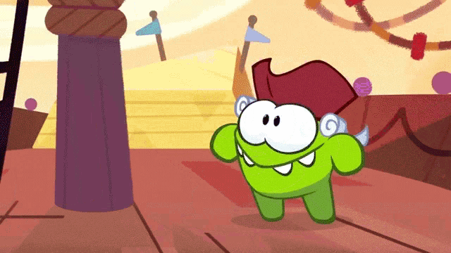 a green cartoon character wearing a red hat is standing in front of a ferris wheel