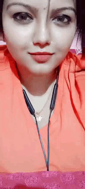 a close up of a woman 's face with headphones on .