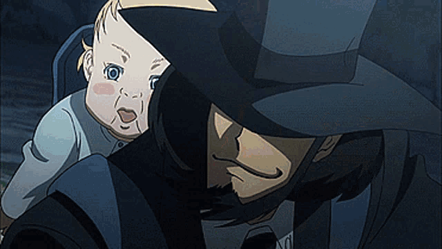 a man in a hat is holding a baby in his arms