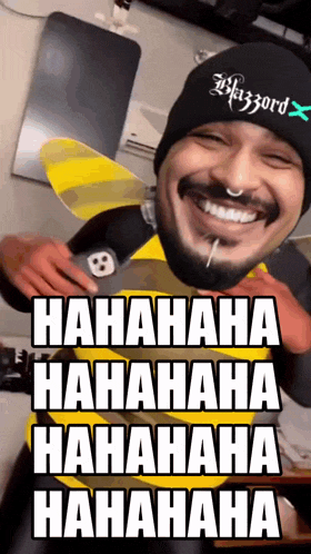 a man wearing a bee costume is laughing with the words hahahaha hahahaha hahahaha  hahaha