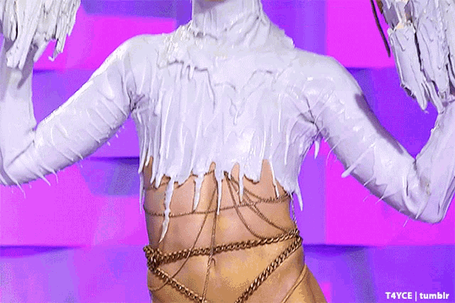 a close up of a person covered in white paint and gold chains with t4yce tumblr in the lower right corner