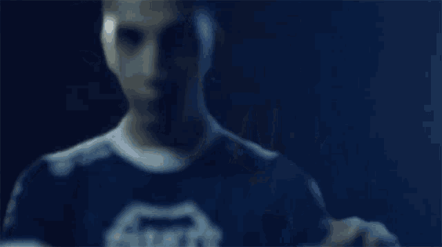 a close up of a man 's fist in a dark room