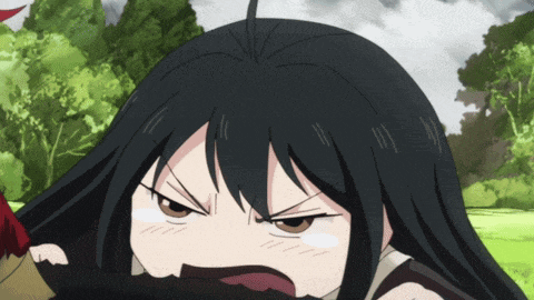a girl with black hair is making a funny face