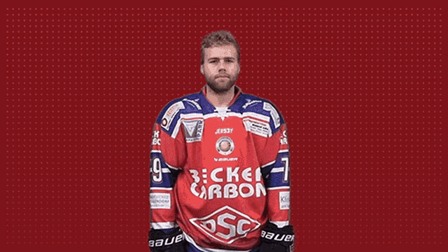 a hockey player is wearing a red and blue jersey that says becke carbon