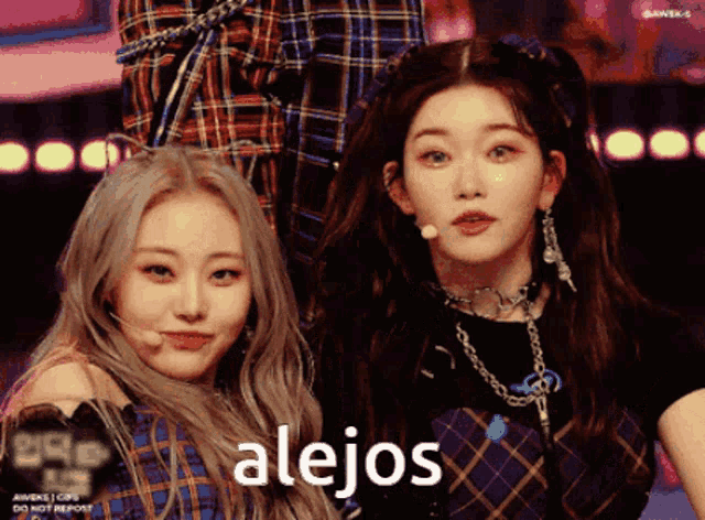 a couple of girls standing next to each other with the word alejos on the bottom right
