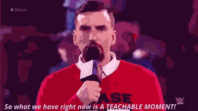 a man holding a microphone with the words so what we have right now is a teachable moment on the bottom