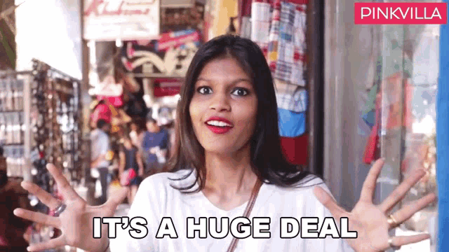 a woman says it 's a huge deal in front of a store