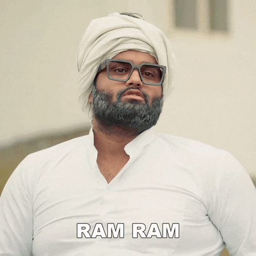 a man wearing a turban and glasses has the name ram ram on the bottom