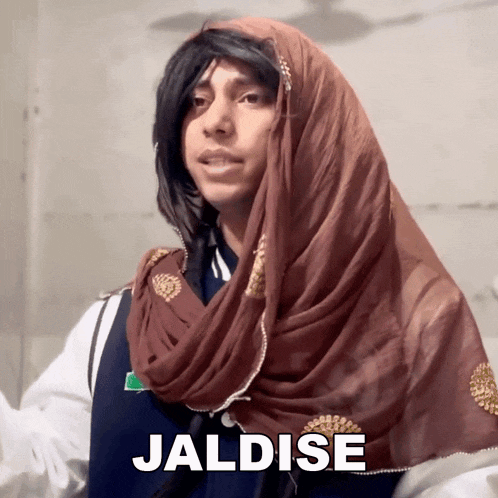 a person with a scarf around their head and the word jaldise in the corner