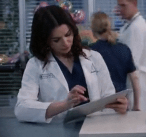 a woman in a lab coat with the letter a on her jacket