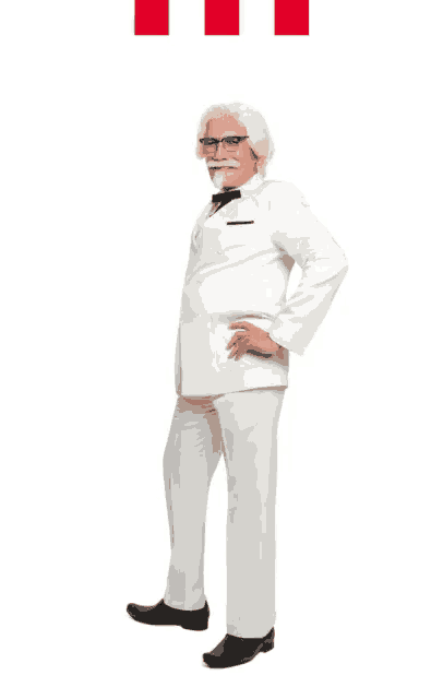 a man in a white suit with a mustache and glasses stands with his hands on his hips