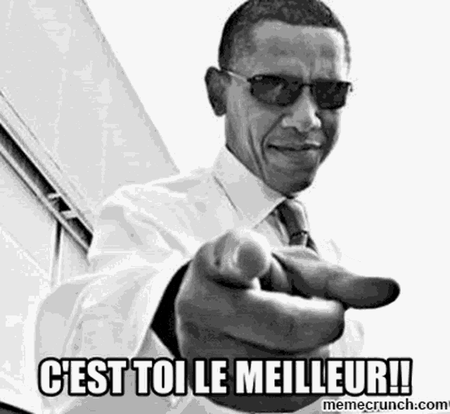 barack obama is pointing at the camera with his finger in a black and white photo .