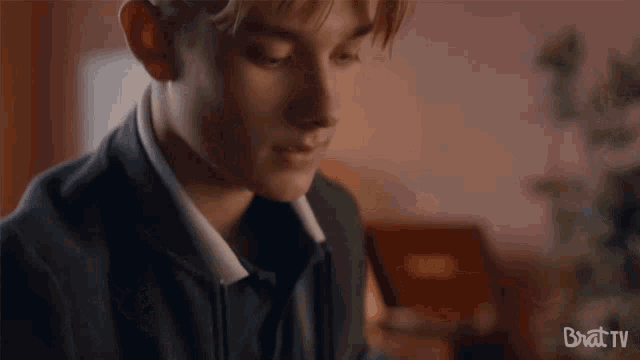 a close up of a young man 's face with the words brat tv visible in the corner