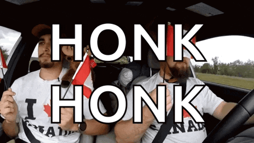 two men in a car with honk honk written on the side