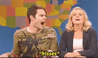 a man and a woman are sitting in front of a map of the united states and the man is saying " hisses "