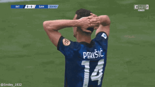 a soccer player wearing a number 14 jersey